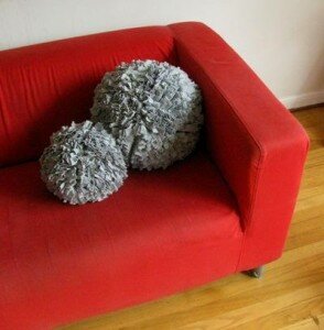 Giant pom pom cushion.